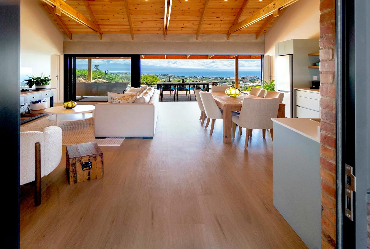 Open-plan living and dining area with panoramic ocean views